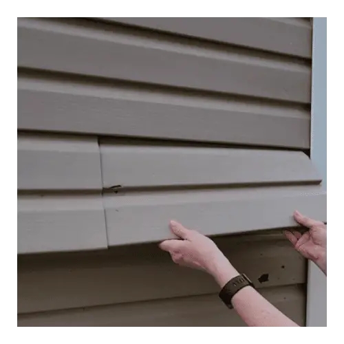 Brown vinyl shed siding with women arms installing